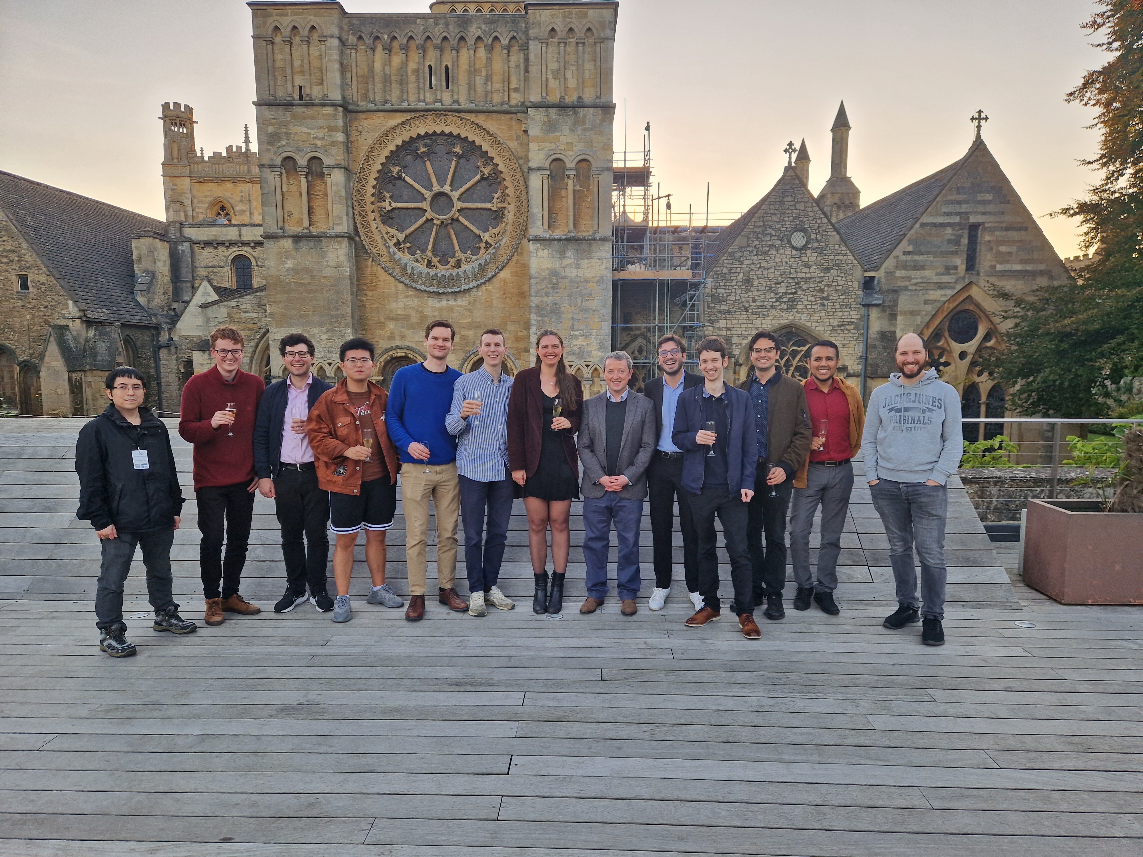 Picture of Patrick Farrell, surrounded by current and former students and postdocs.